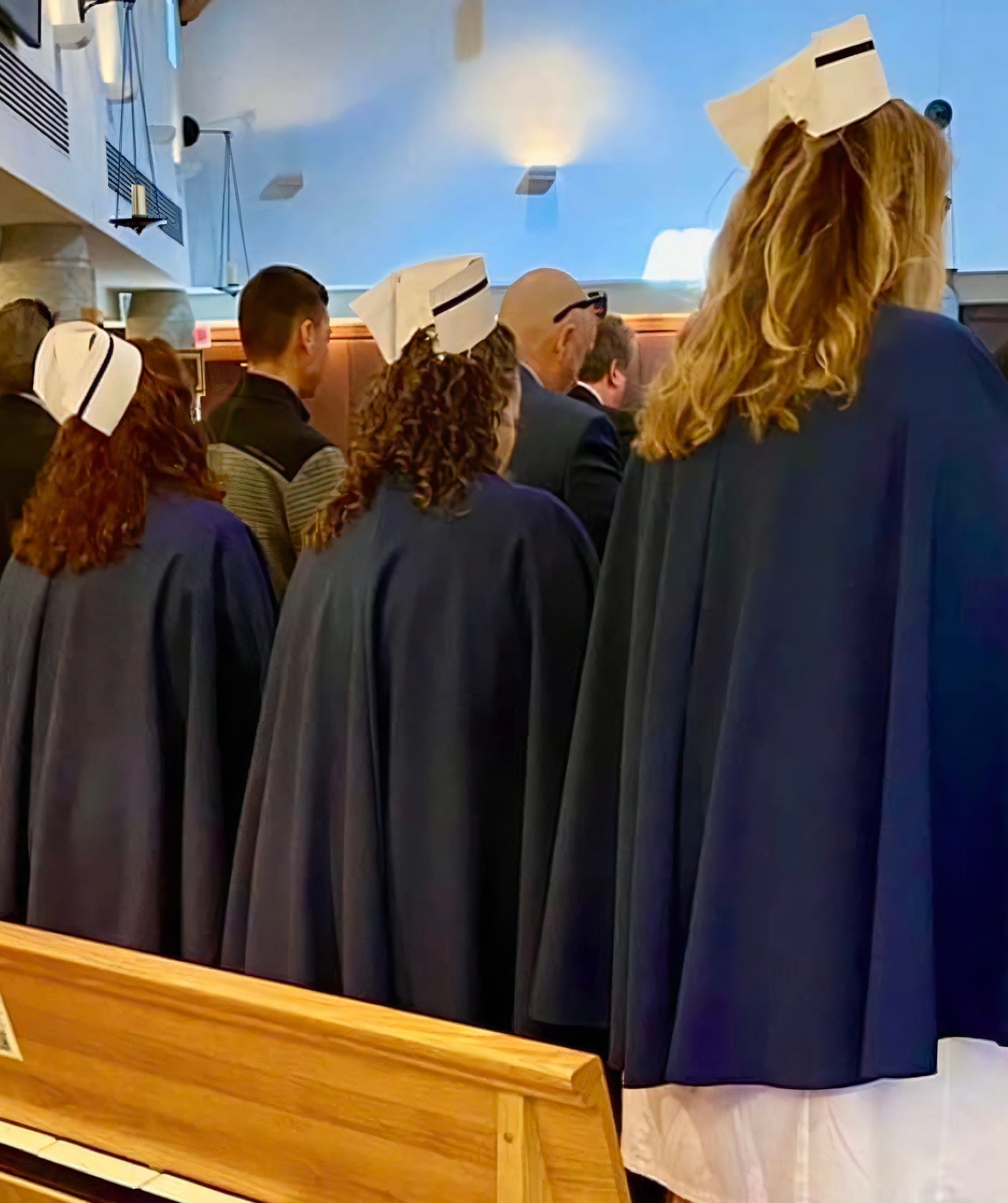 MDNHG Members at a service with their back turned